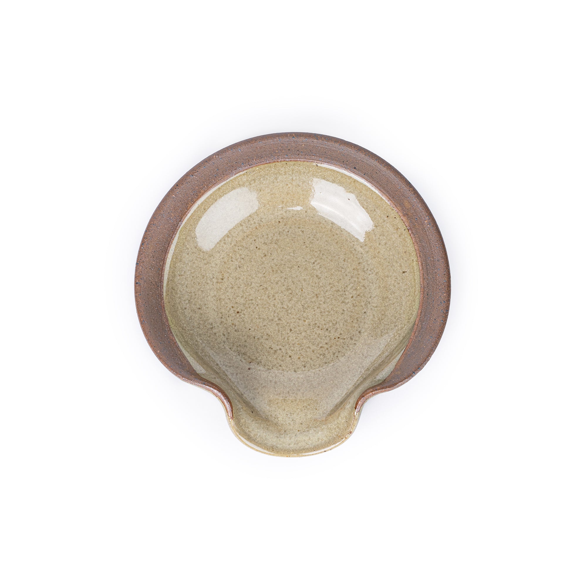 A circular ceramic spoon rest in a reflective grey-green color featuring iron speckles and unglazed ridge rim