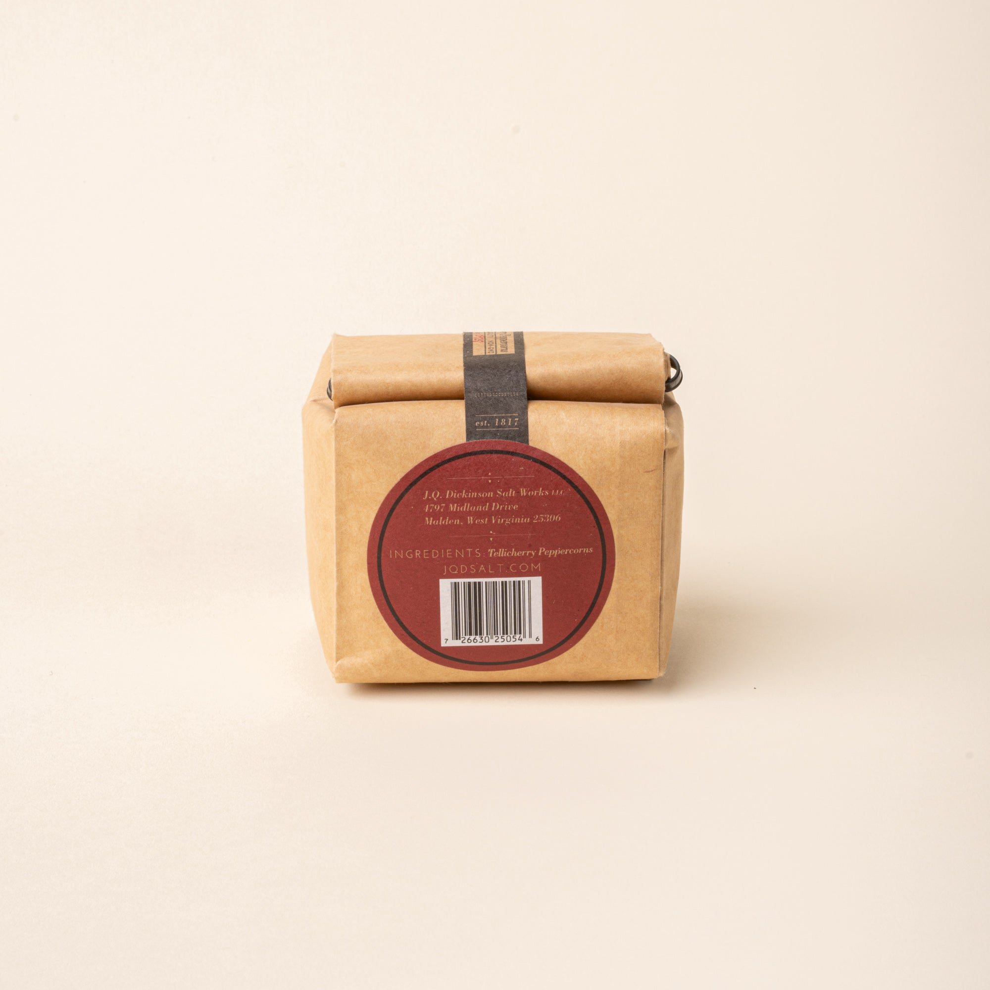 Back of Bag of J.Q. Dickinson Tellicherry Peppercorns on a plain white background.