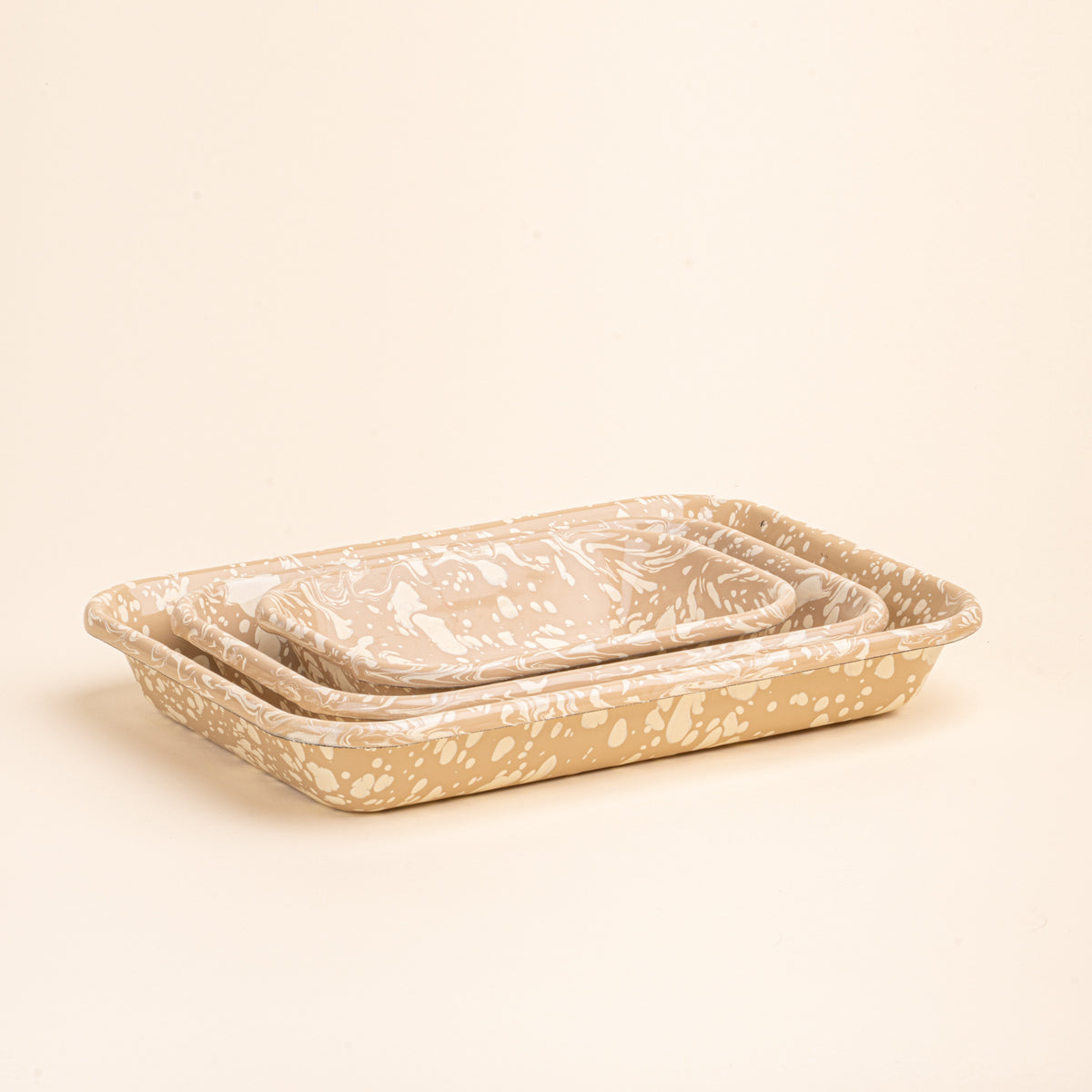 3 nesting trio rectangular baking dishes in a neutral tan color with off-white splattered pattern