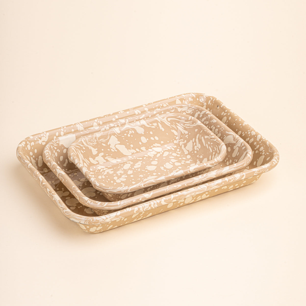 3 nesting trio rectangular baking dishes in a neutral tan color with off-white splattered pattern