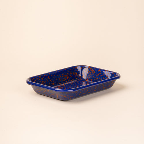 Medium rectangular baking dish in a midnight blue color with red splatter pattern.