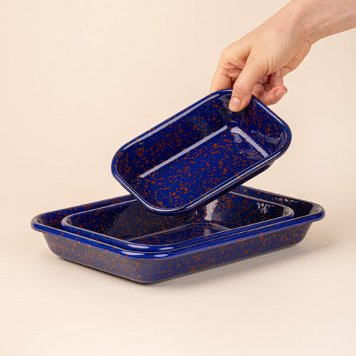 3 nesting trio rectangular baking dishes in a midnight blue color with red splattered pattern