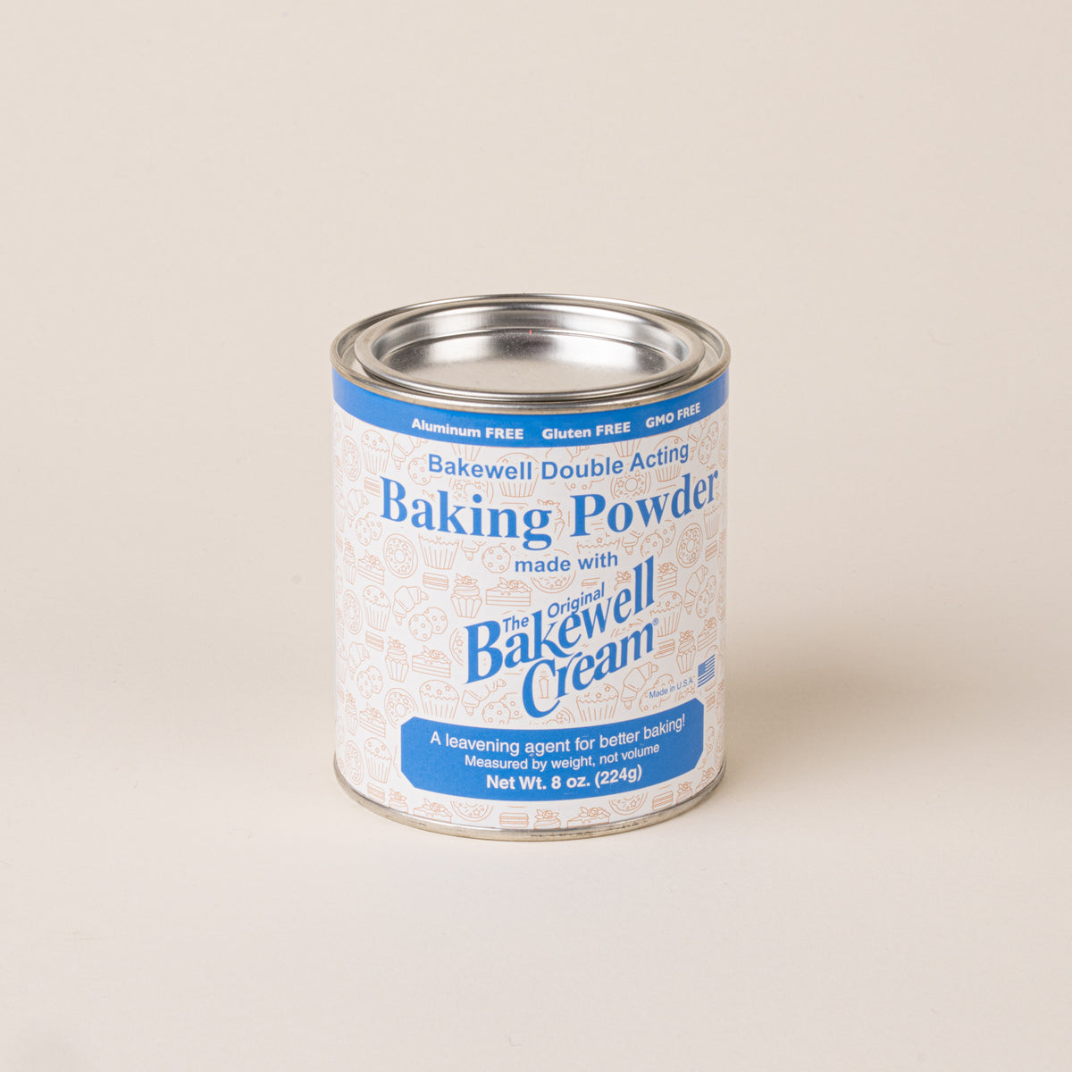 8 oz. can of Bakewell Cream double-acting baking powder with blue and white packaging and a silver metal lid.
