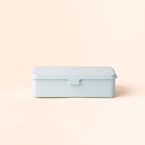 Light blue rectangular storage container with a fitted lid and front tab closure, shown against a cream background.