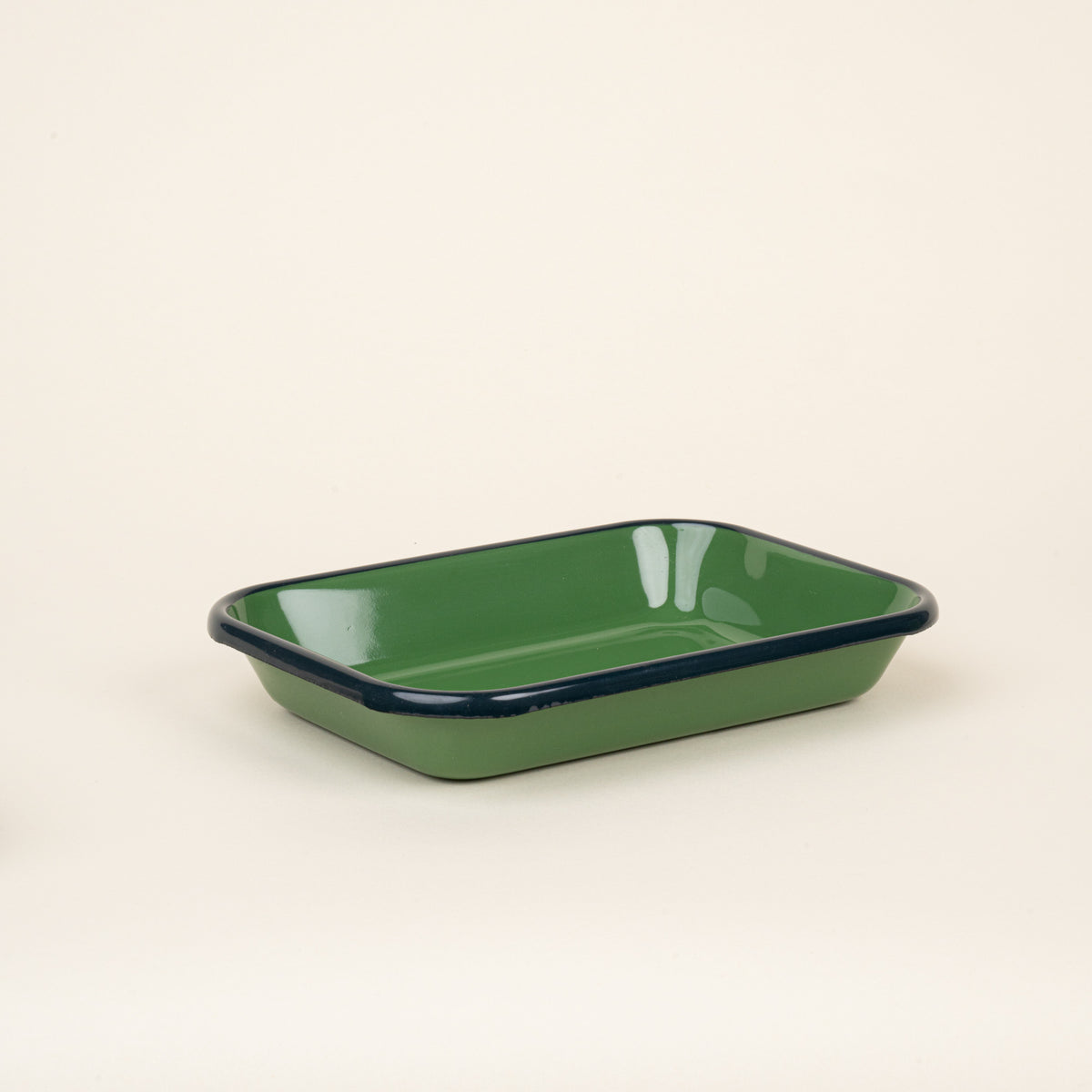 Medium rectangular baking dish in a green color with a dark green rim.