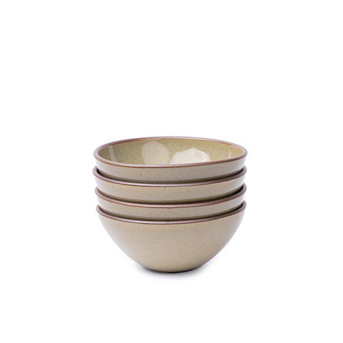 A stack of 4 medium rounded ceramic bowls in a reflective dappled grey-green color featuring an unglazed rim