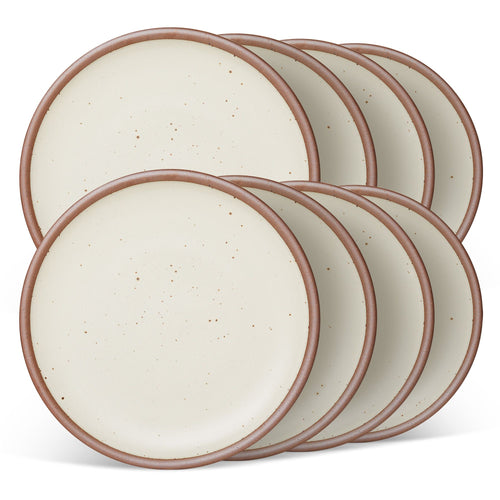 8 dinner sized ceramic plates in a warm off-white color featuring iron speckles and an unglazed rim