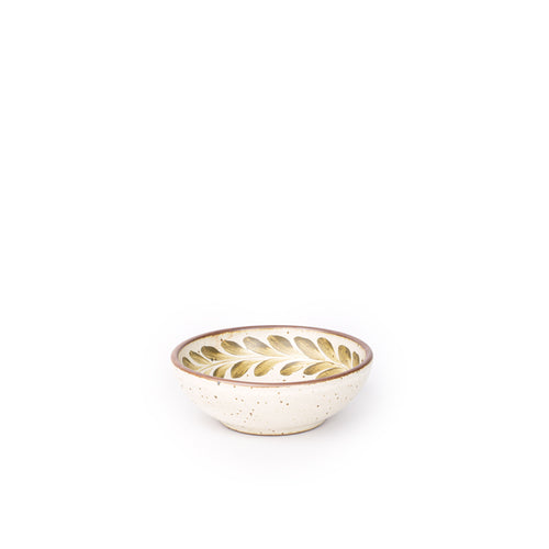 Small ceramic shallow bowl with a hand-painted olive green leaf border on a cream interior and speckled cream exterior with an exposed clay rim.