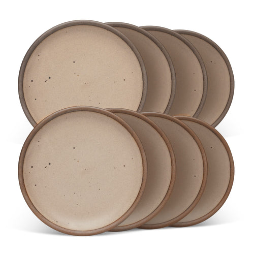 8 medium sized ceramic plates in a warm pale brown color featuring iron speckles and an unglazed rim.