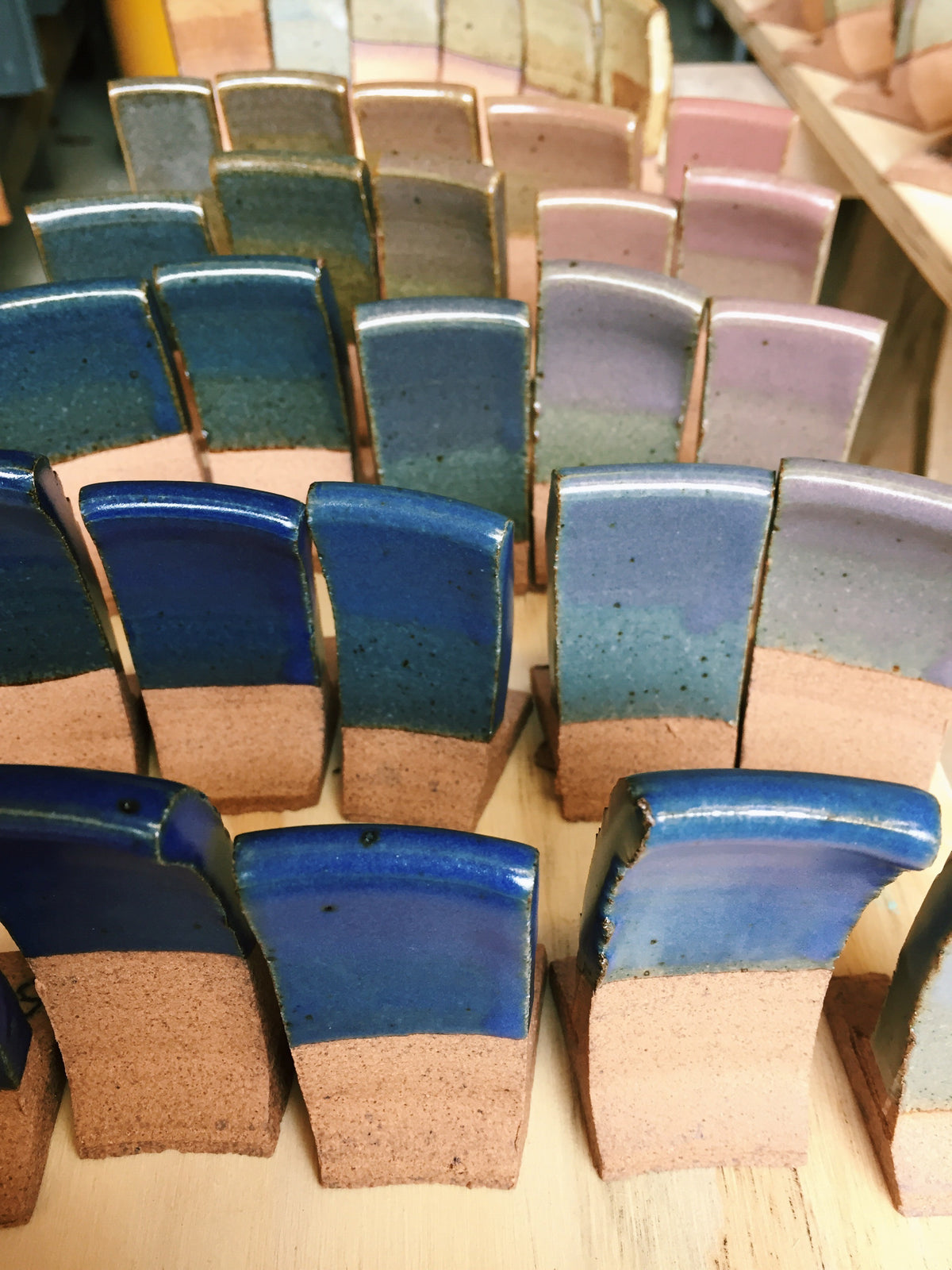 A collection of test tiles from early line blends. Indigo and Thistle—two of the six colors we opened our Asheville store with—were pulled from these tests.&nbsp;