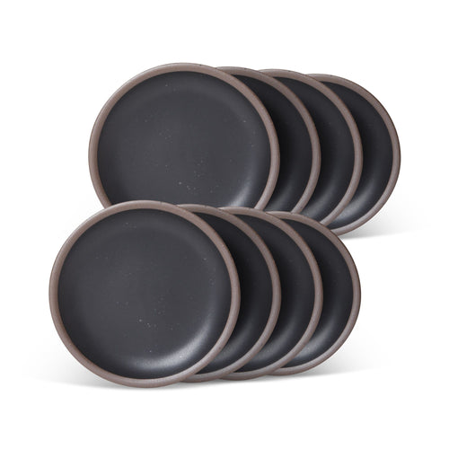 8 dessert sized ceramic plates in a graphite black color featuring iron speckles and an unglazed rim.