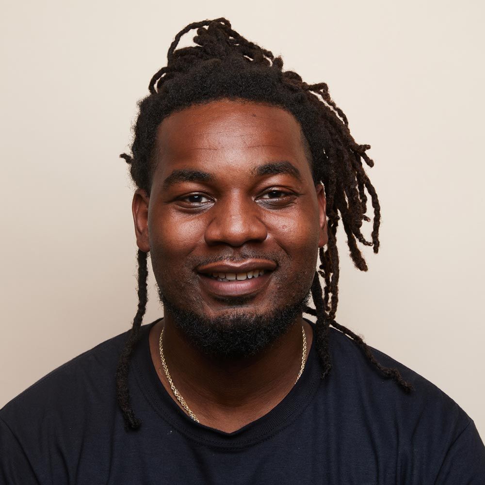 A headshot of TJ H.