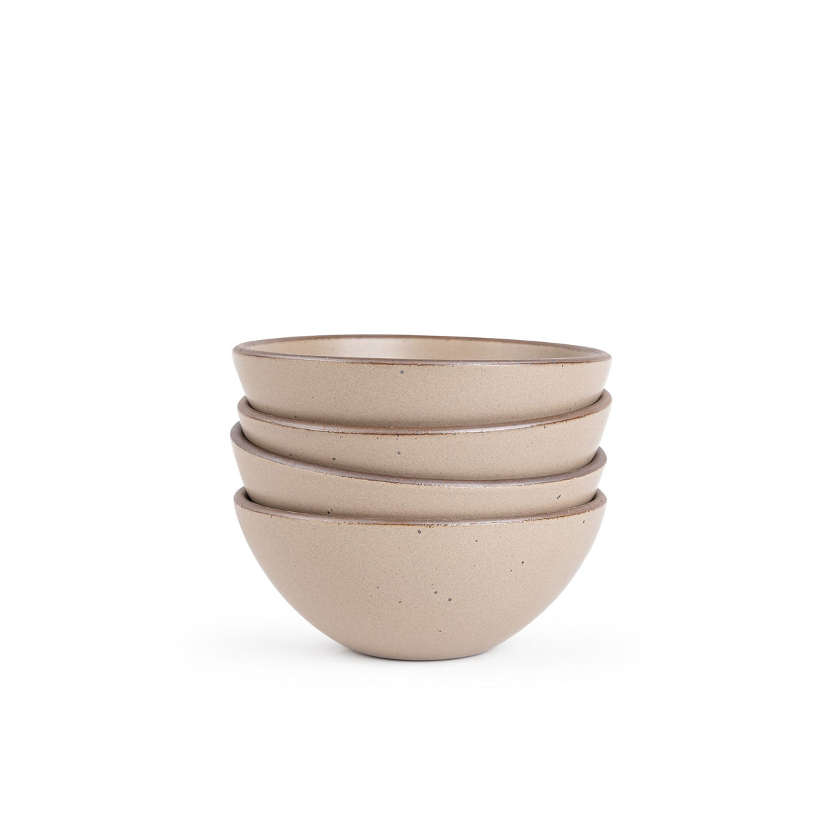 A stack of 4 medium rounded ceramic bowls in a warm pale brown color featuring iron speckles and an unglazed rim