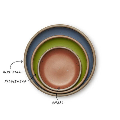 A stack of 3 plates in Dinner, Side, and Cake sizes in a cool, medium blue, fern green, and cool terracotta colors.