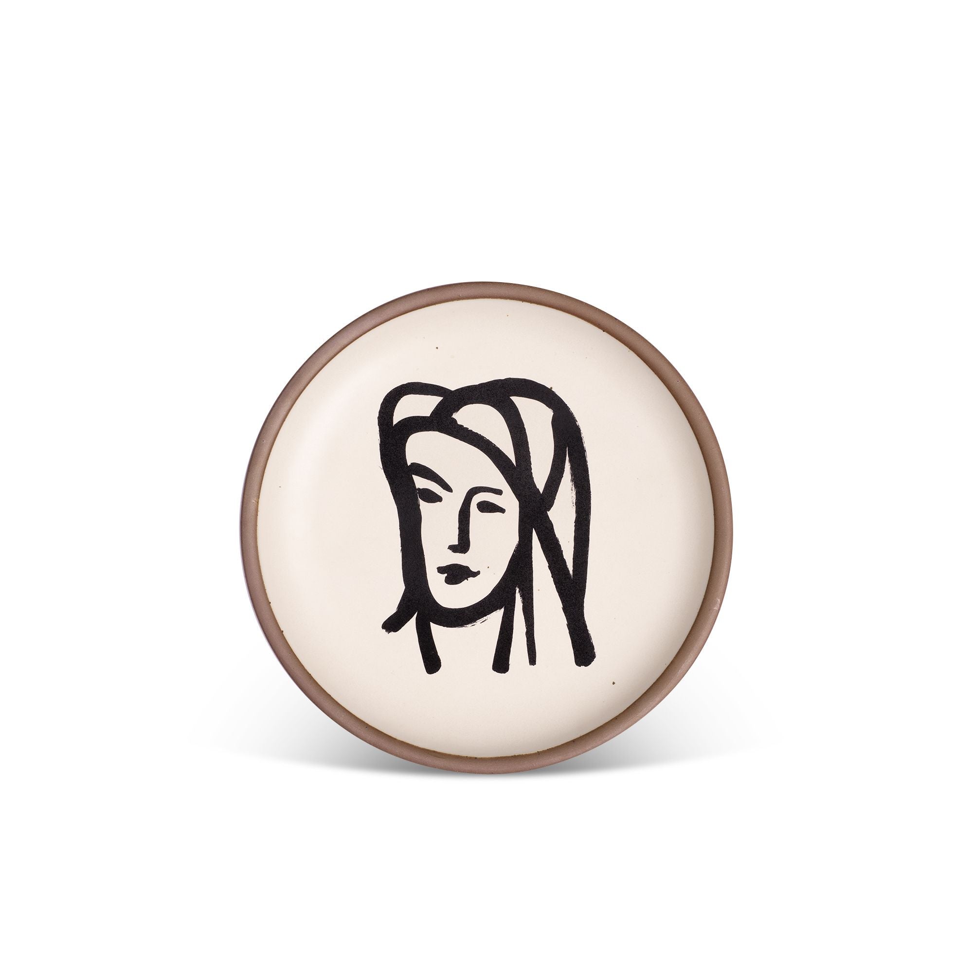 A ceramic plate featuring a decal of the artwork, Bédouine au grand voile, by Henri Matisse. A minimalist black ink decal of a woman's face wearing a large veil depicted by bold brushstrokes in an abstract, expressive style centered on an off-white ceramic plate with an unglazed rim.