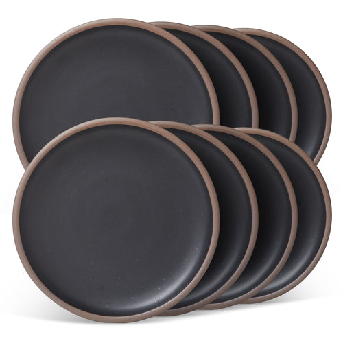 8 dinner sized ceramic plates in a graphite black color featuring iron speckles and an unglazed rim