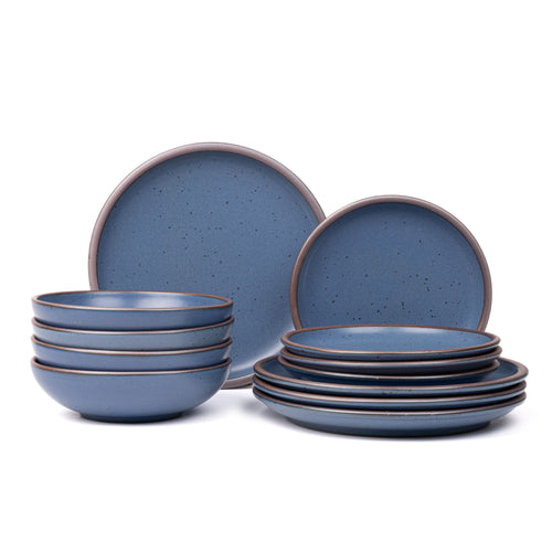 4 ceramic dinner plates, 4 side plates, and 4 shallow dinner bowls in a cool medium blue color with iron speckles and unglazed rims.